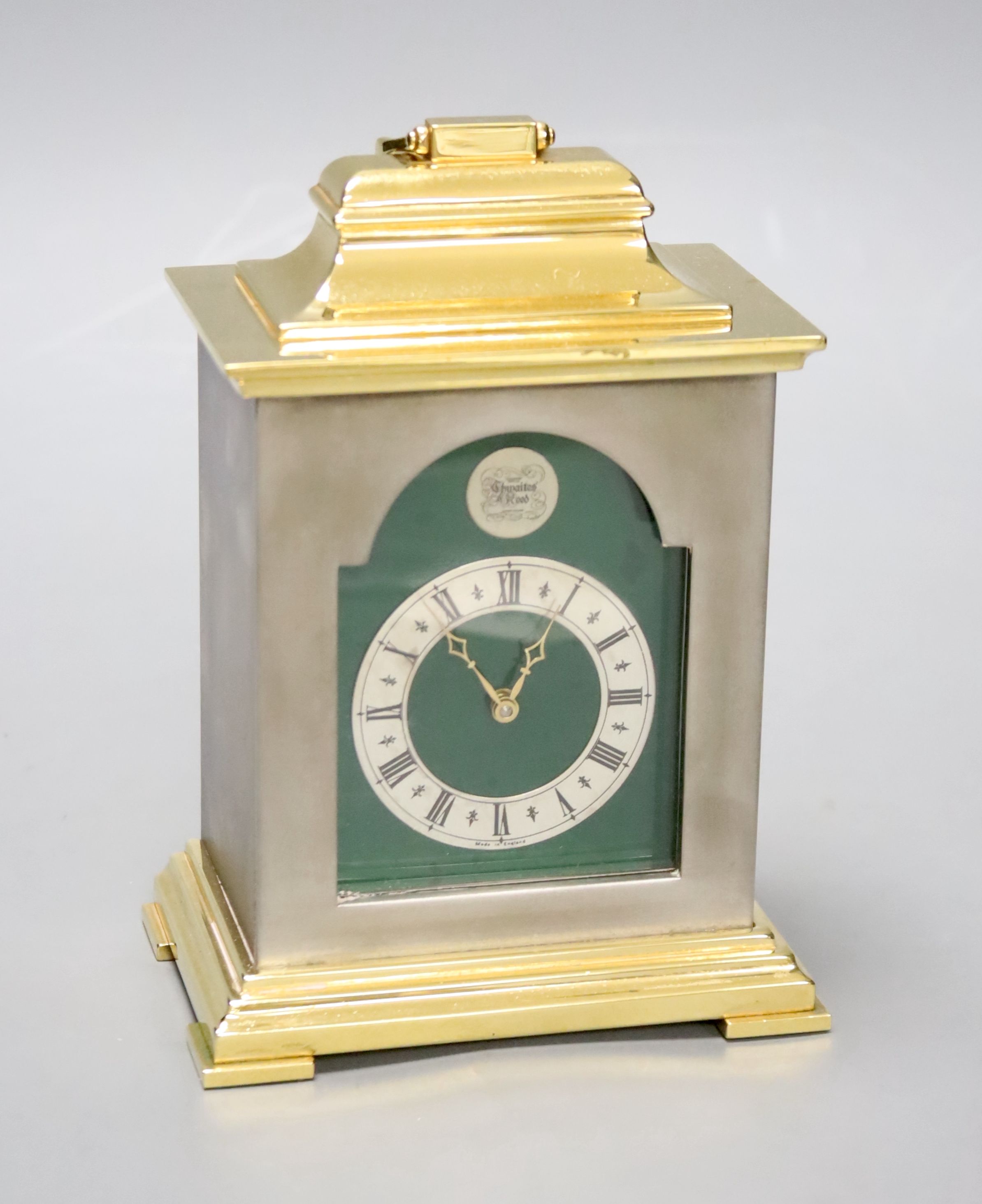 A small Georgian style silvered and gilt metal mantel timepiece by Thwaites & Reed, H 16cm